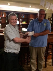 TASA chairman John Daly receives the cheque from Kelburn Brewery  MD, Derek Moore.